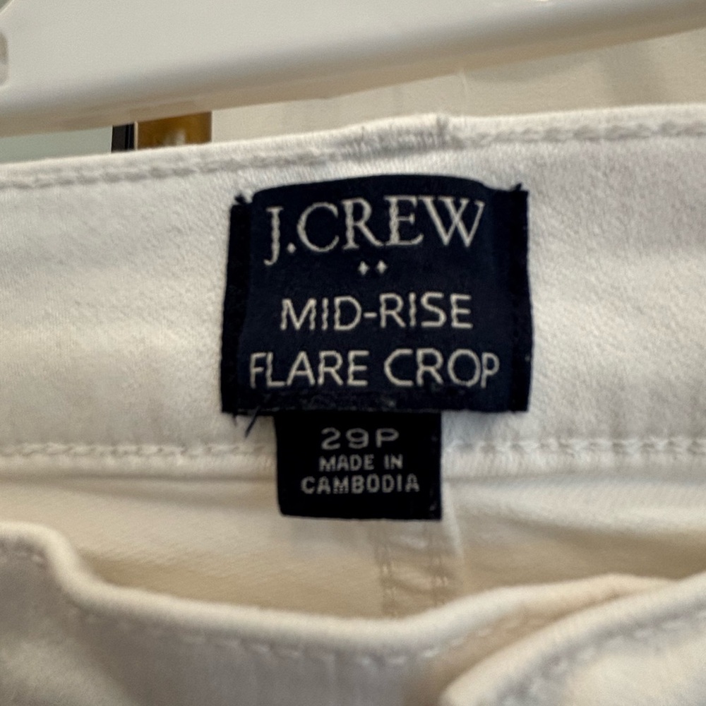 J Crew Midrise white jeans with a flare.